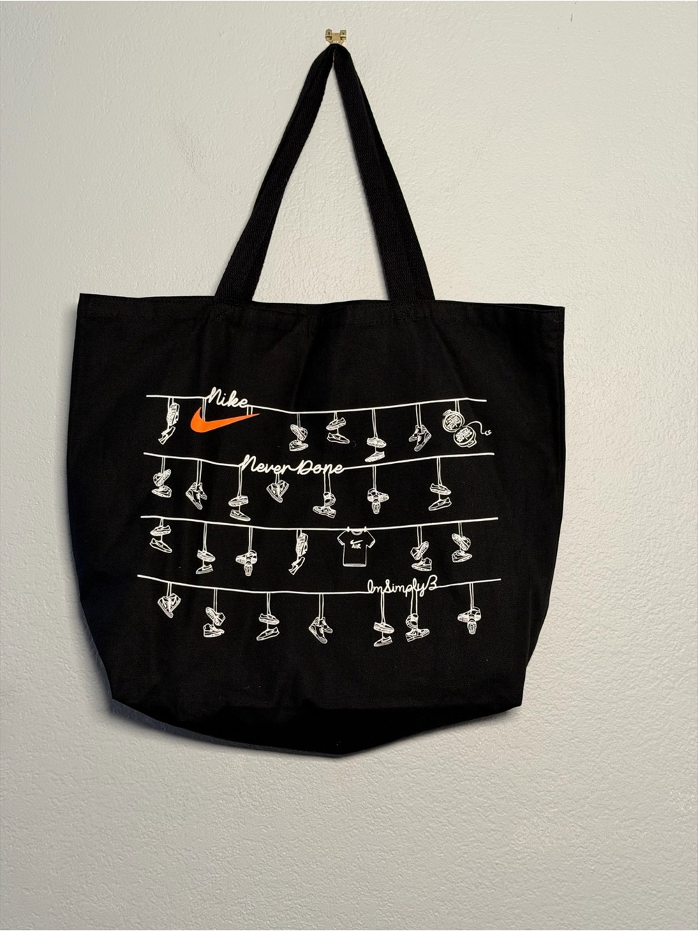 Nike limited edition Never Done Black Tote Bag with Orange Swoosh